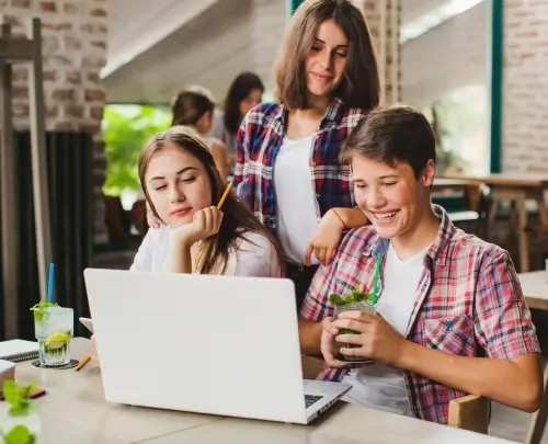 Happy group of young students learning Forex, Crypto, and online earning together in a lively classroom session at GS Trainings Pakistan.